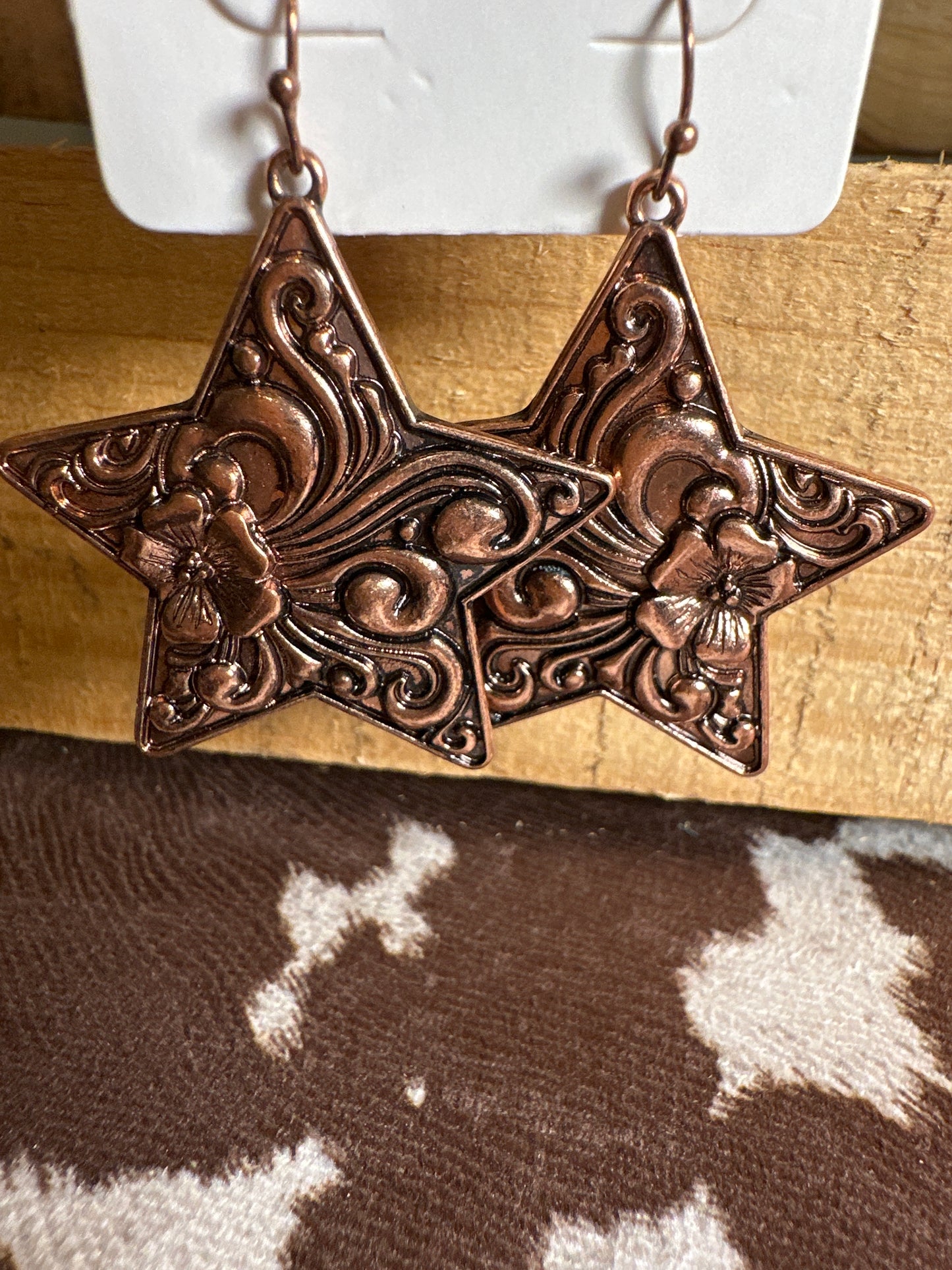 Star tooled earring